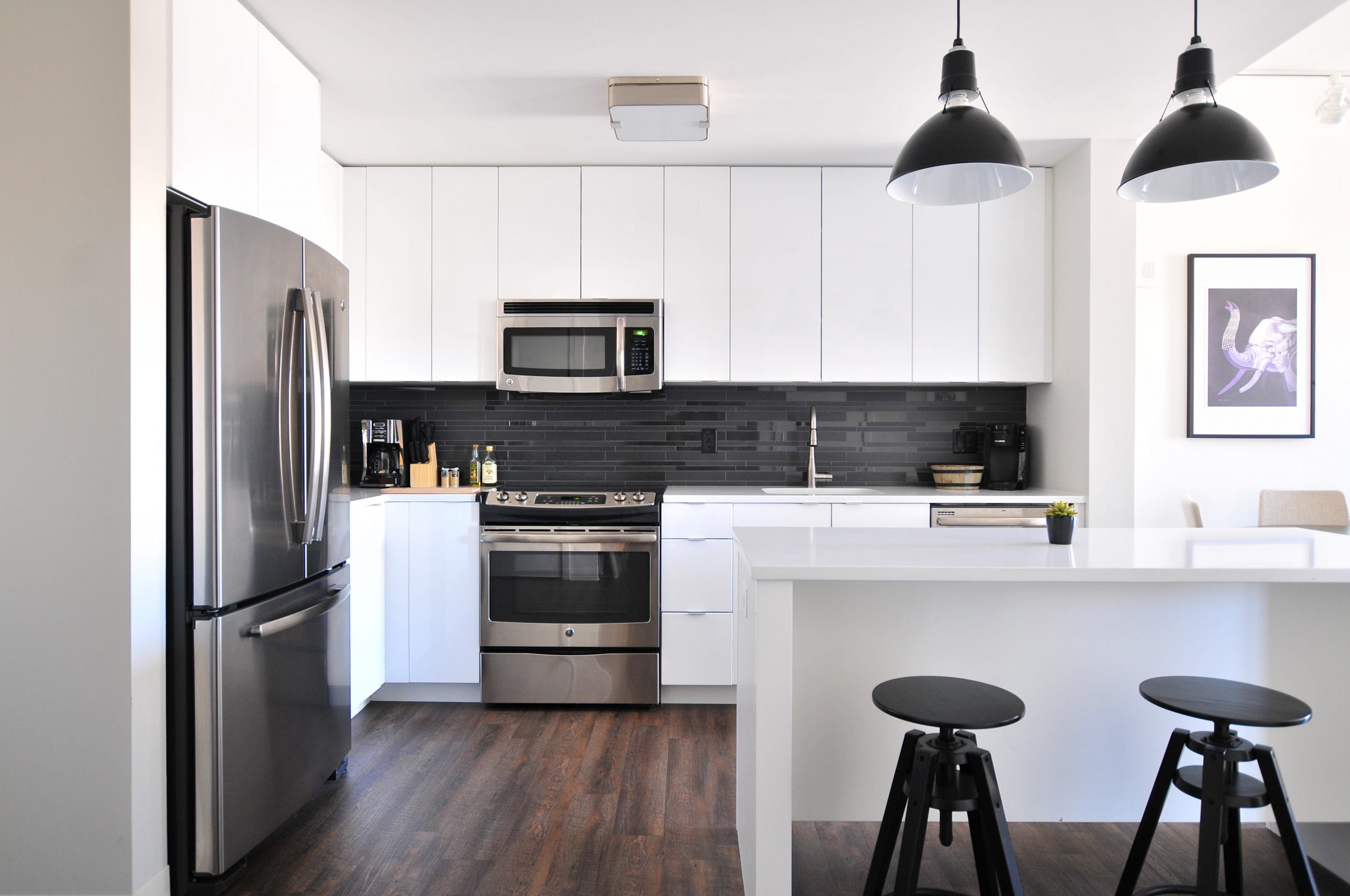 Home Upgrades That Are Worth the Investment gray steel 3-door refrigerator near modular kitchen