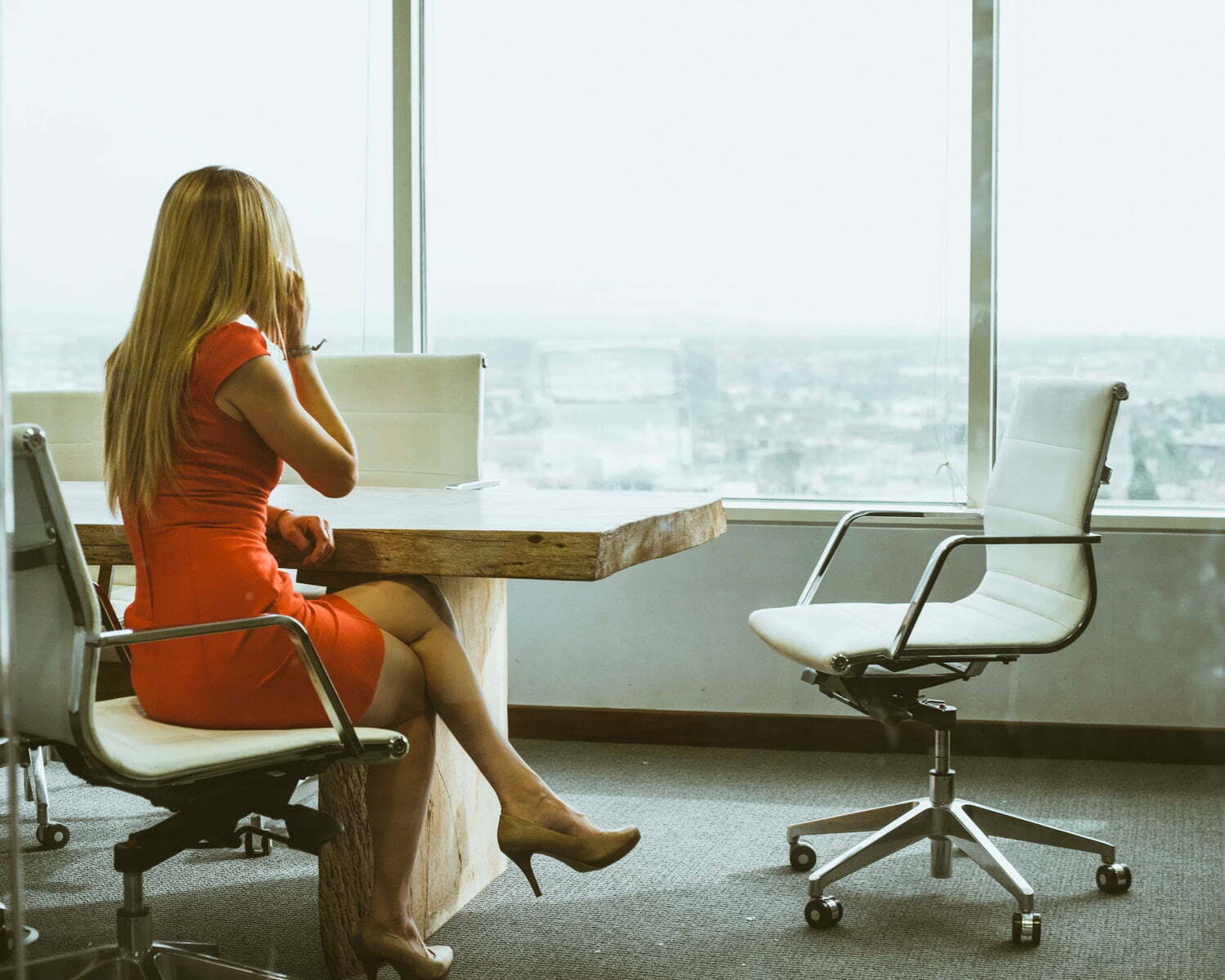 Adapt And Overcome: Identifying The Five VoIP Biggest Challenges You Can Address Today woman talking through mobile phone while sitting on swivel armchair