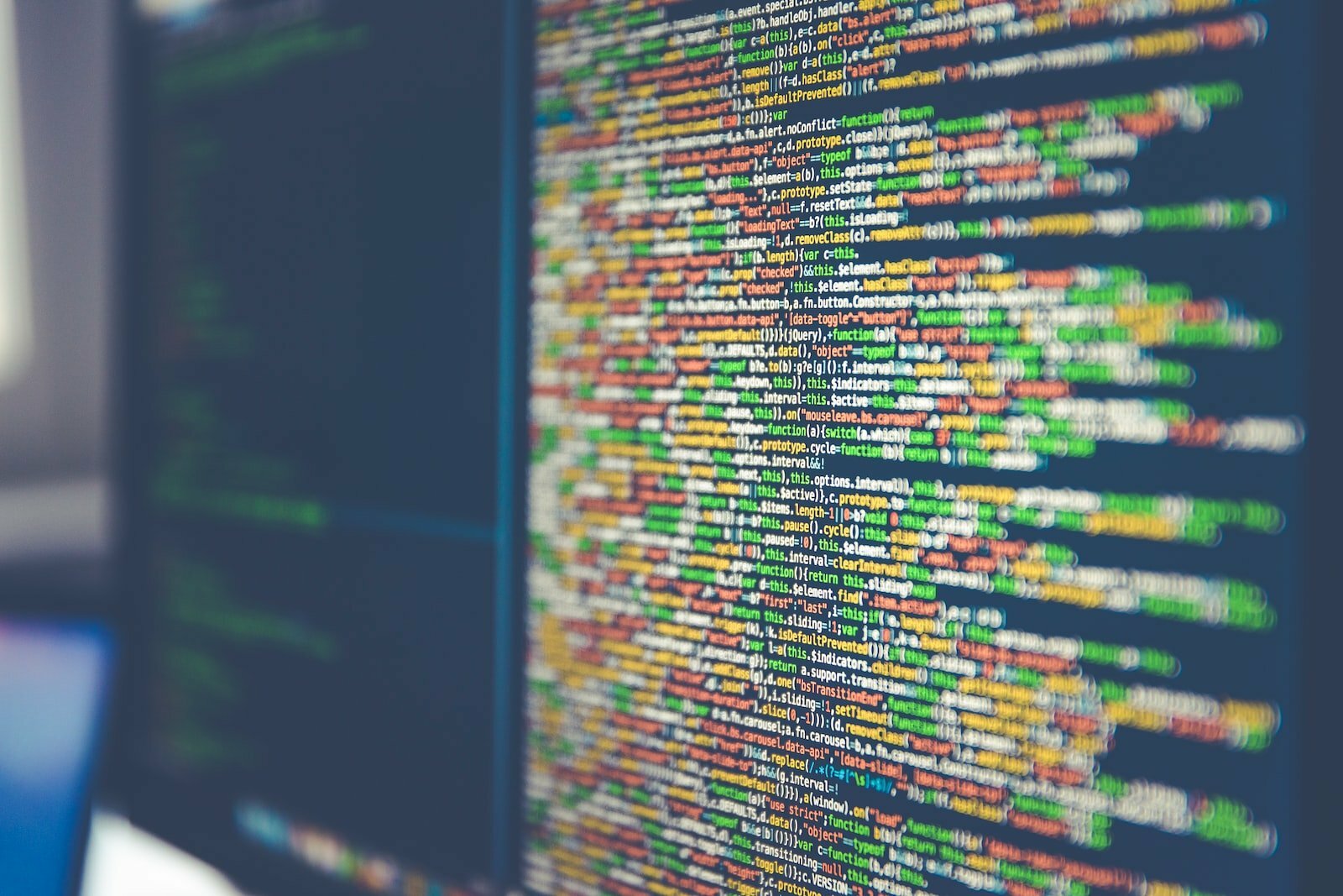 How Technology Can Help With the Onboarding and Recruitment Process Colorful software or web code on a computer monitor