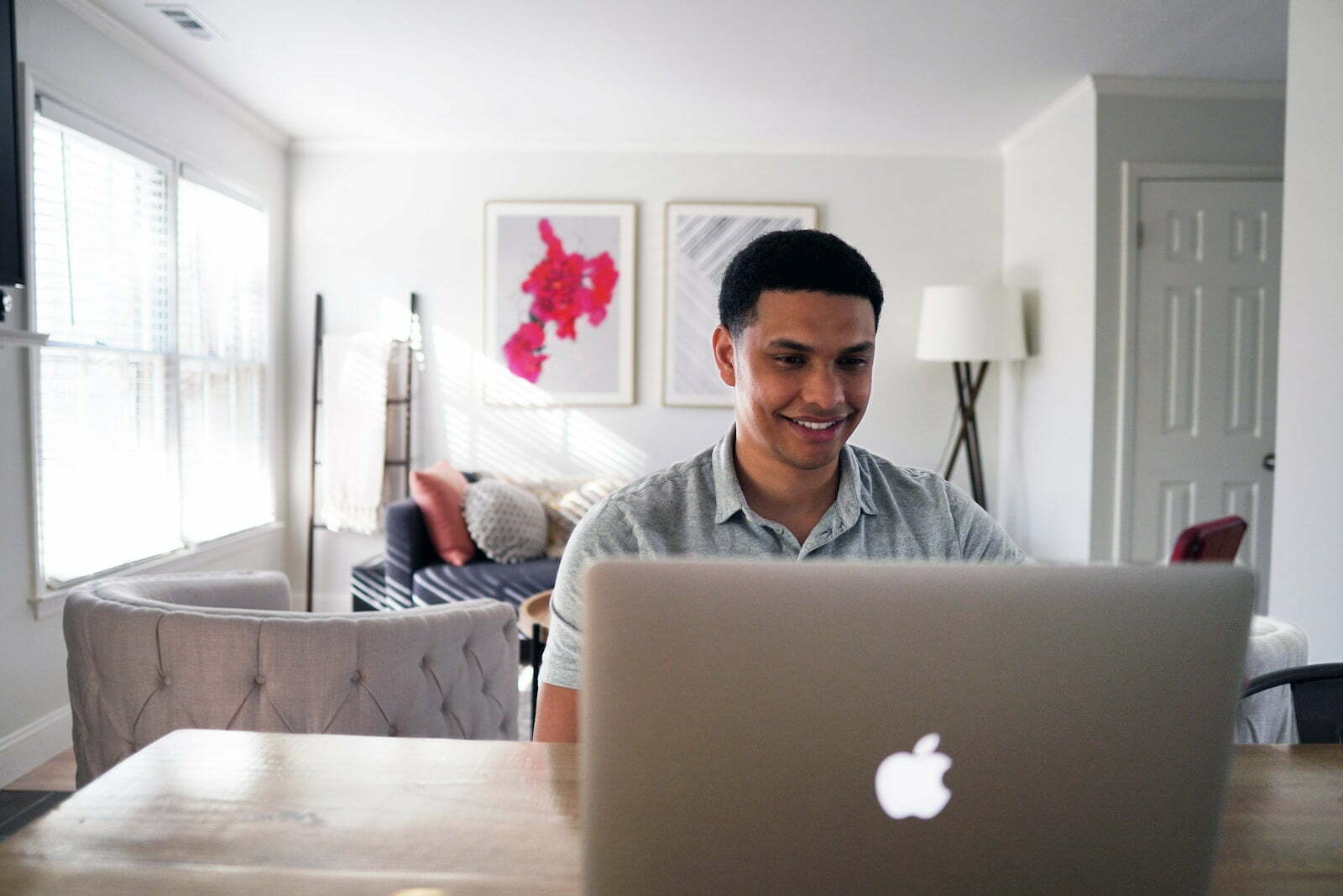 Real Estate Expert Corey Shader Provides 3 Investing Ideas Beyond the Single-Family Home man in gray hoodie sitting on chair in front of silver macbook
