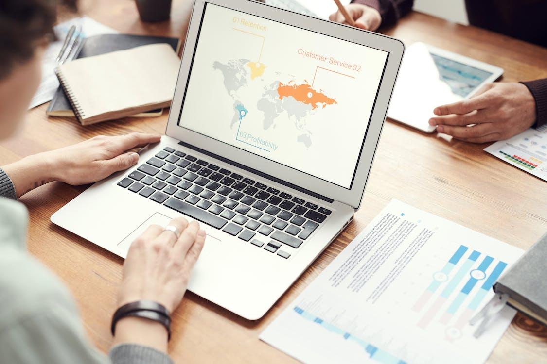 Glocalization - What Is It, and Why Does It Matter? Free Photo Of Person Using Laptop Stock Photo