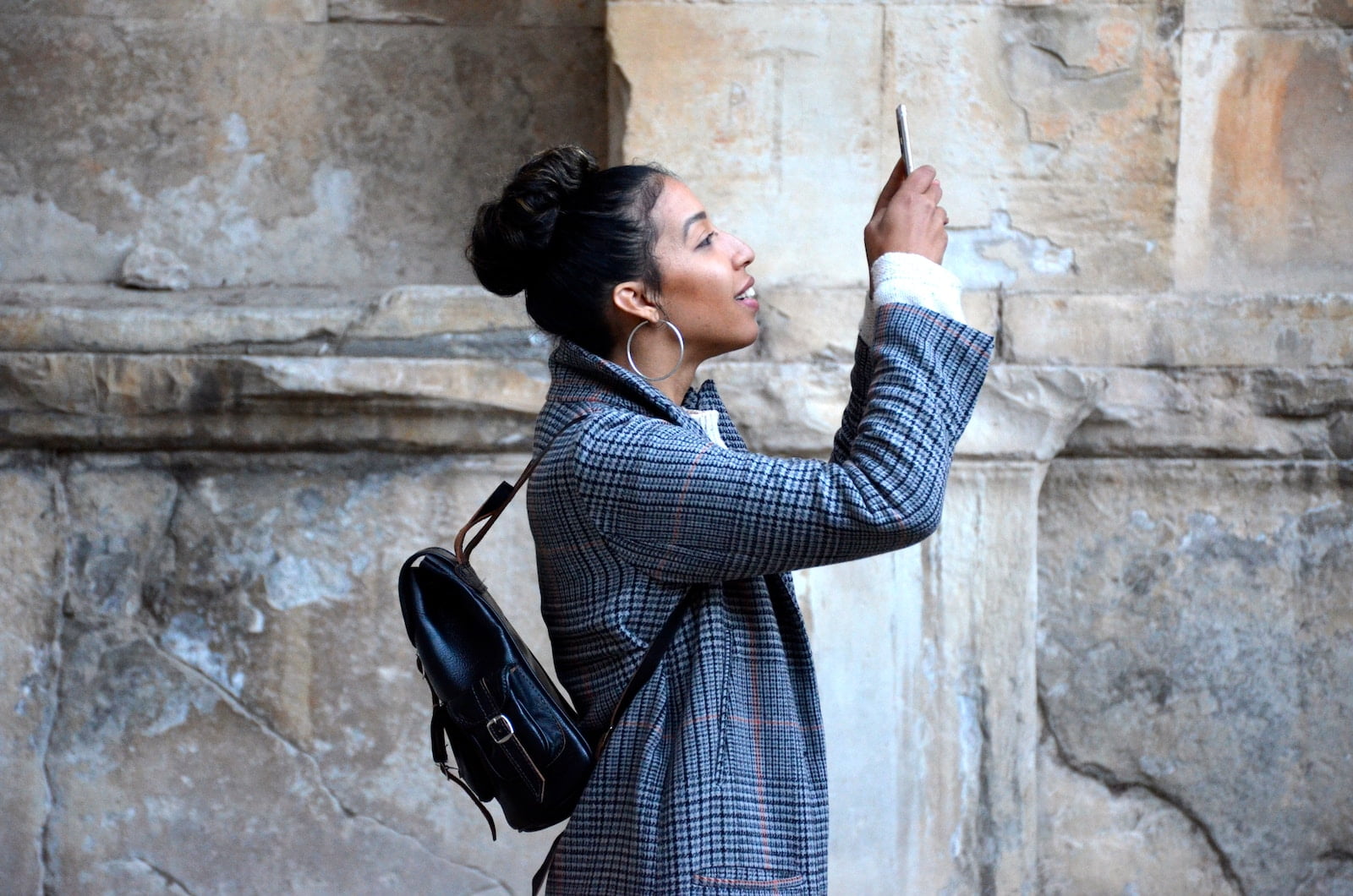 4 Ways to Cut Back on Social Media Addiction woman wearing blue shirt while looking at her phone
