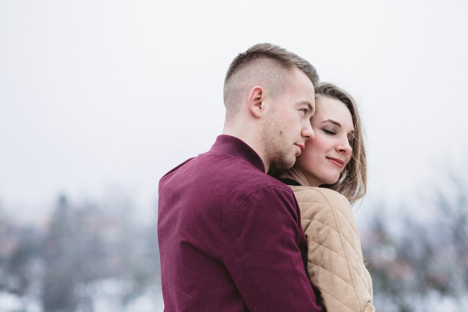 Healthy Relationships: Tips for Nurturing Harmony Between Men and Women man hugging woman while standing on snowy weather