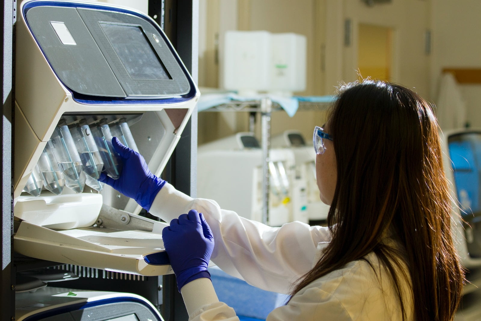 Paternity Tests: Answering Your Most Common Questions woman holding test tubes