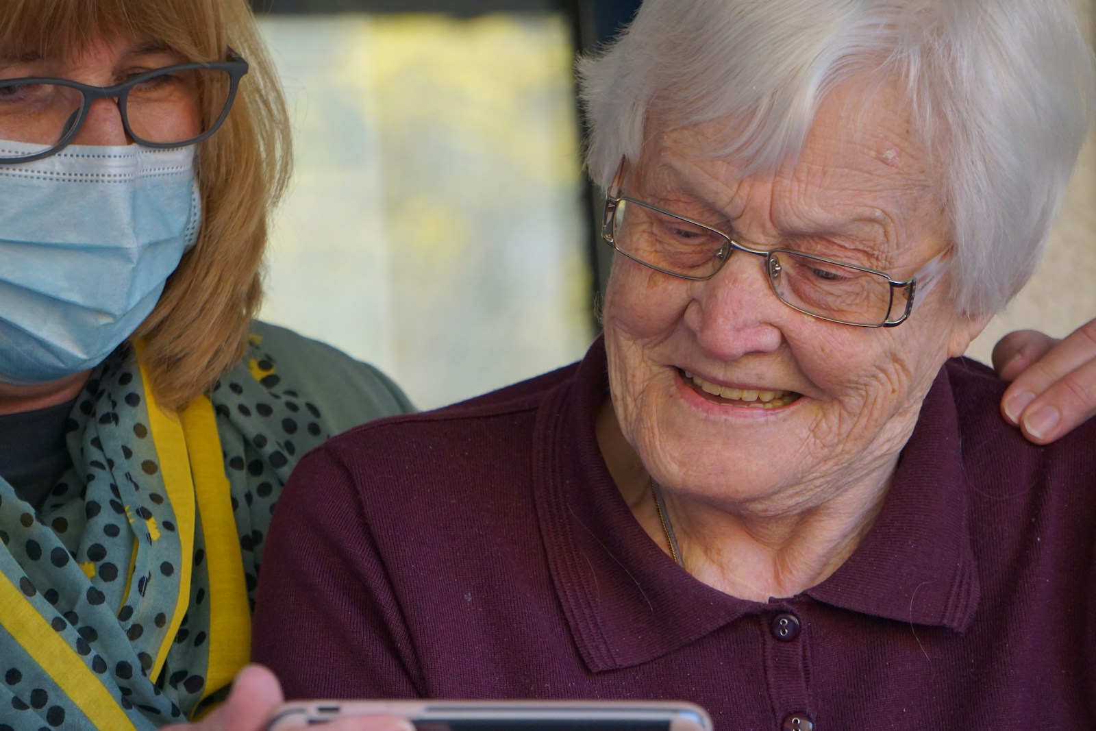 Exploring In-Home Care: A Comprehensive Guide woman in purple polo shirt wearing eyeglasses