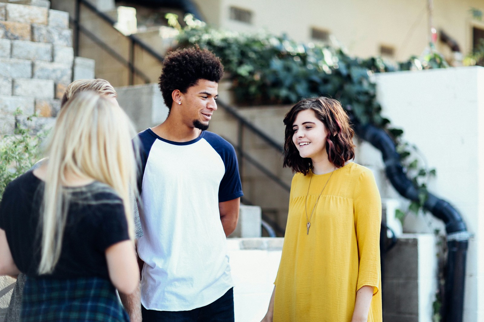 Promoting Emotional Well-being in Teens: Practical Parenting Tips women and man talking outside the building
