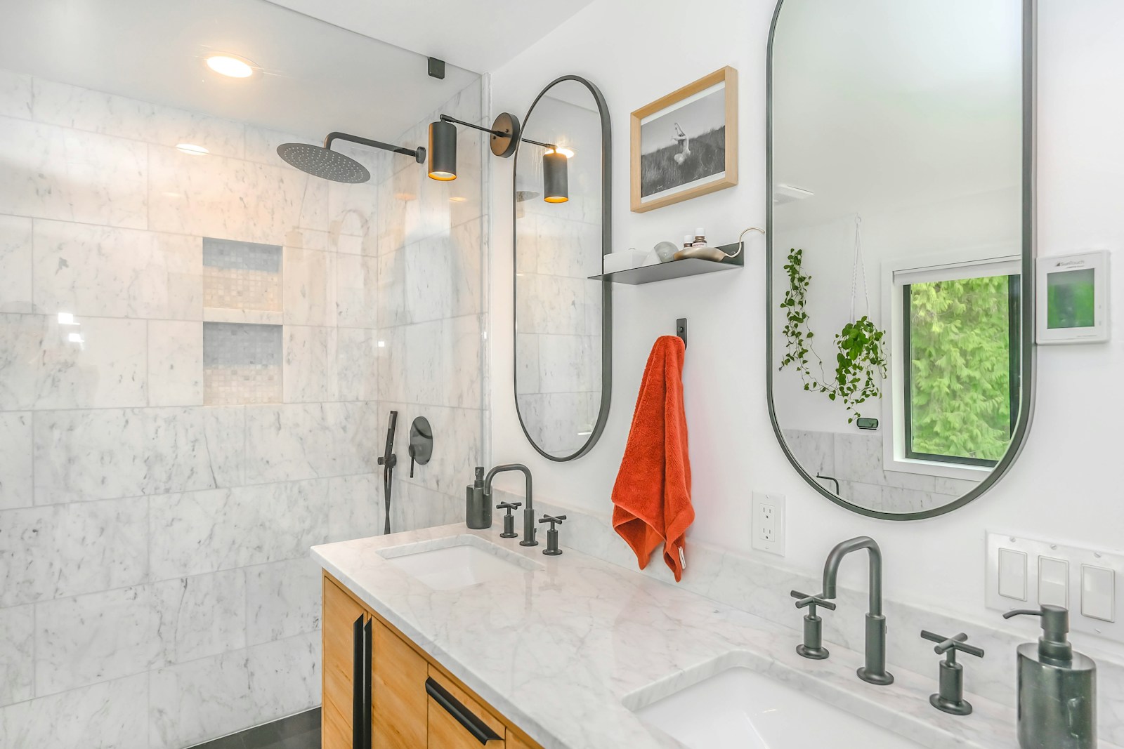 Stunning Bathroom Transformations by Detroit’s Leading Remodelers red towel on stainless steel towel rack