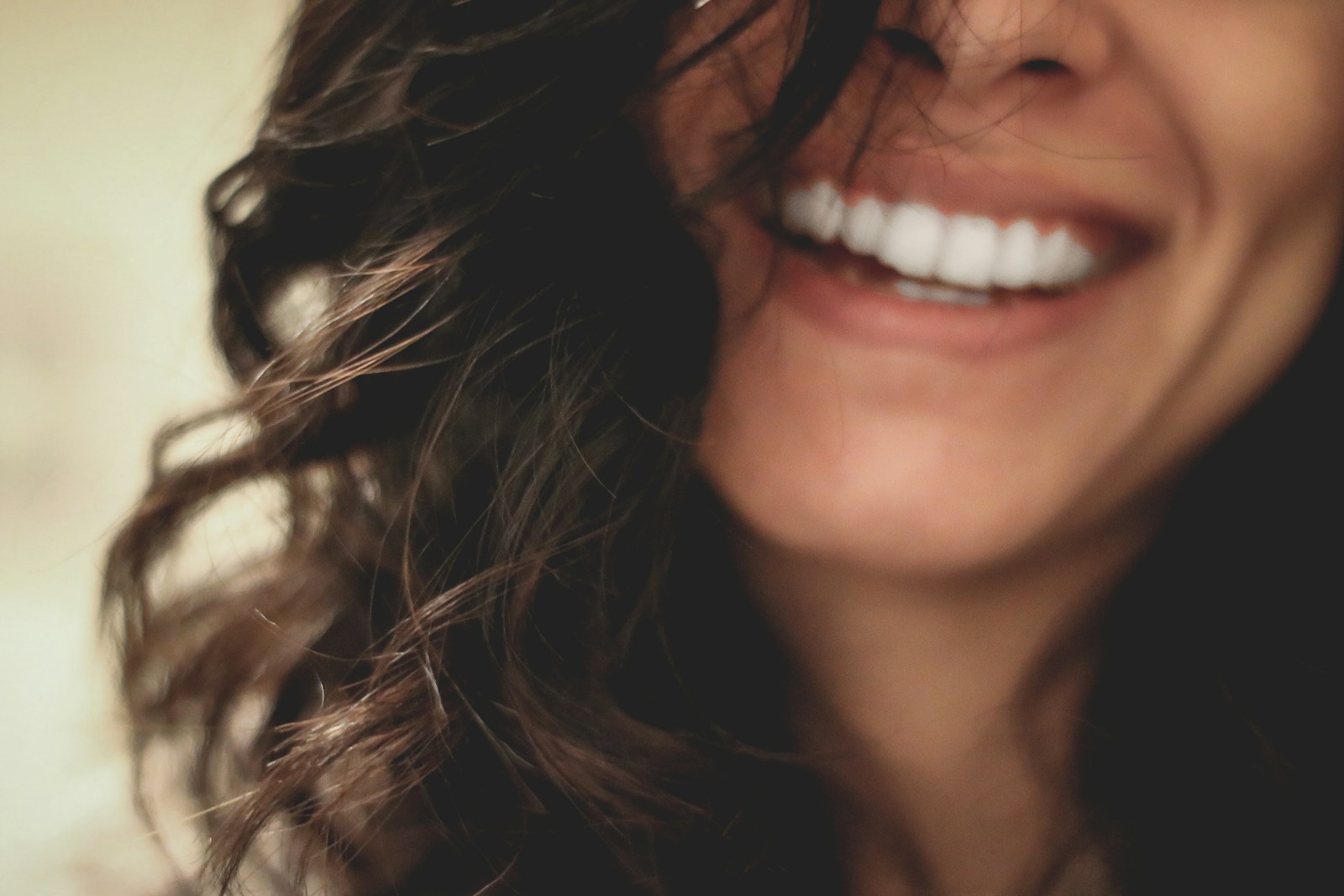 Why Preventive Dentistry Is Essential For A Balanced, Beautiful Smile long black haired woman smiling close-up photography