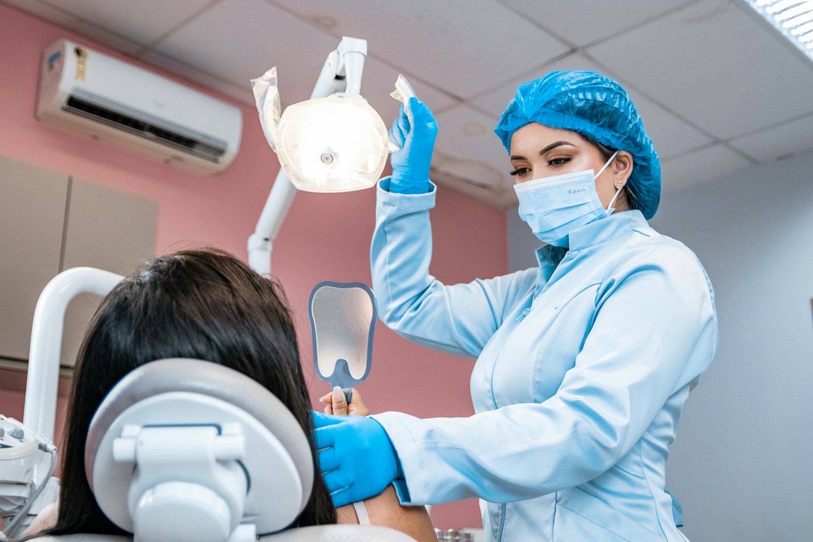 Why Preventive Dental Care Strengthens Smiles Across Generations a woman getting her teeth checked by a dentist