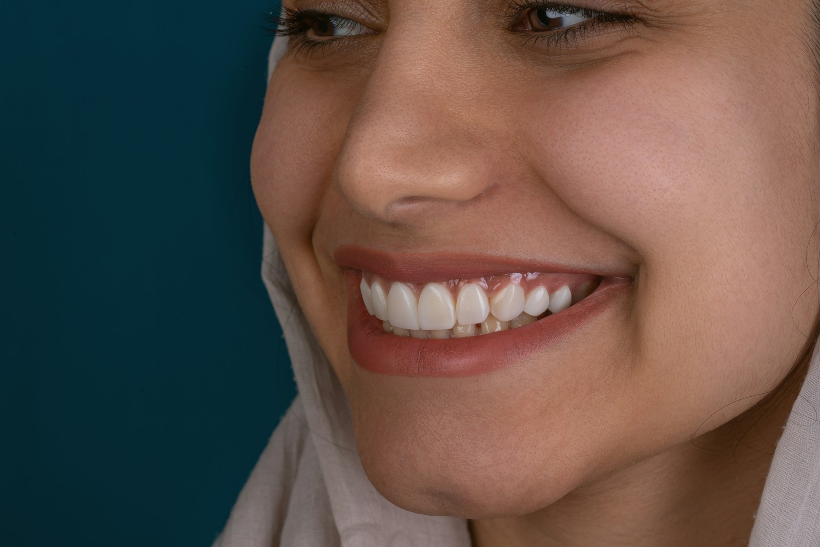 6 Cosmetic Dentistry Treatments That Enhance Smiles For Every Generation a close up of a woman with a smile on her face