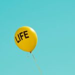 yellow life-printed balloon